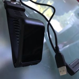 Garmin Vivoactive HR smartwatch with charger